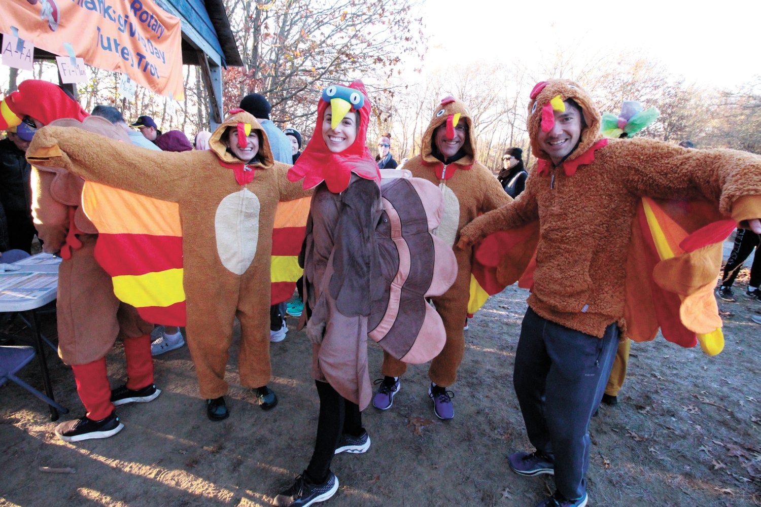 READY TO TAKE FLIGHT: Katie and Erik Egge had a full brood of turkey friends for the trot. They won one of the costume contests of the event.