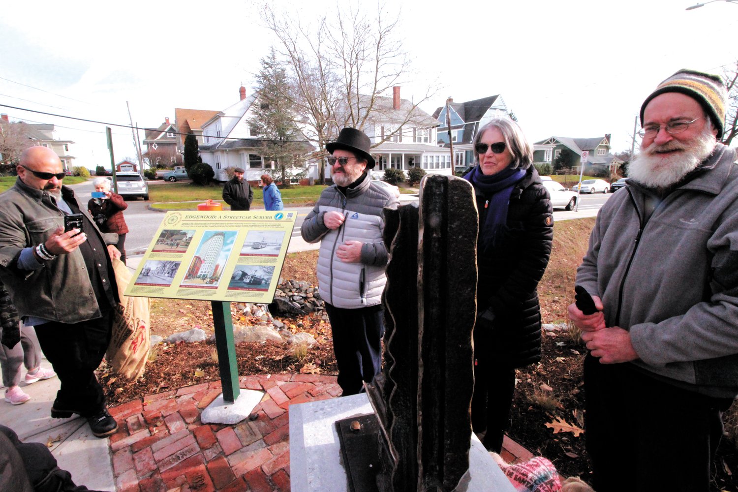 THEY ALL HAD A HAND IN IT:  Dennis Conte, Cranston City Mason;  David Goldenberg, filmmaker  who inspired the recognition of the end of the line marker; Barbara Rubine, president of the Edgewood Waterfront Preservation Association and artist David Karoff gather following the unveiling of the sculpture Sunday. (Cranston Herald photos)