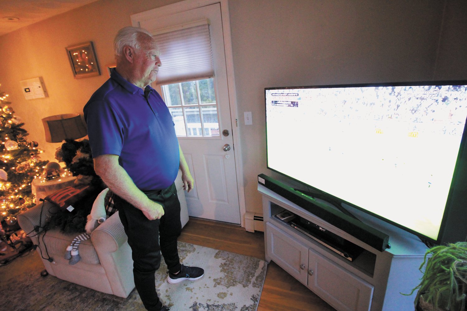 GLUED TO THE TELLIE: Mickey Rooney watches the World Cup last week in his home, where he has viewed every game of the tournament. (Cranston Herald Photo)