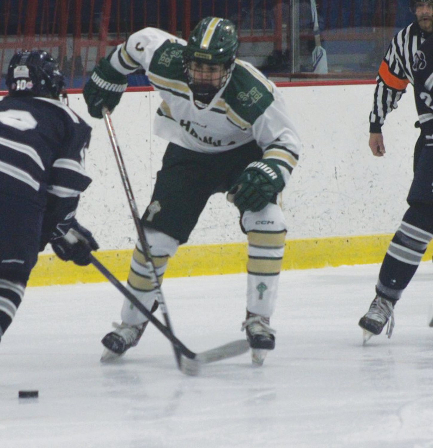 UP THE ICE: Griffin Crain skates past defenders. (Photos by Alex Sponseller)