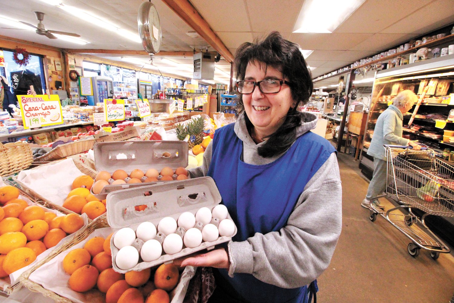 STILL MORE THAN $5 A DOZEN: Annie Meschino of Sandy Lane Meat Market in Warwick finds the higher cost of eggs has slowed sales, but she is hearing from suppliers that prices appear to be softening. (Warwick Beacon photo)