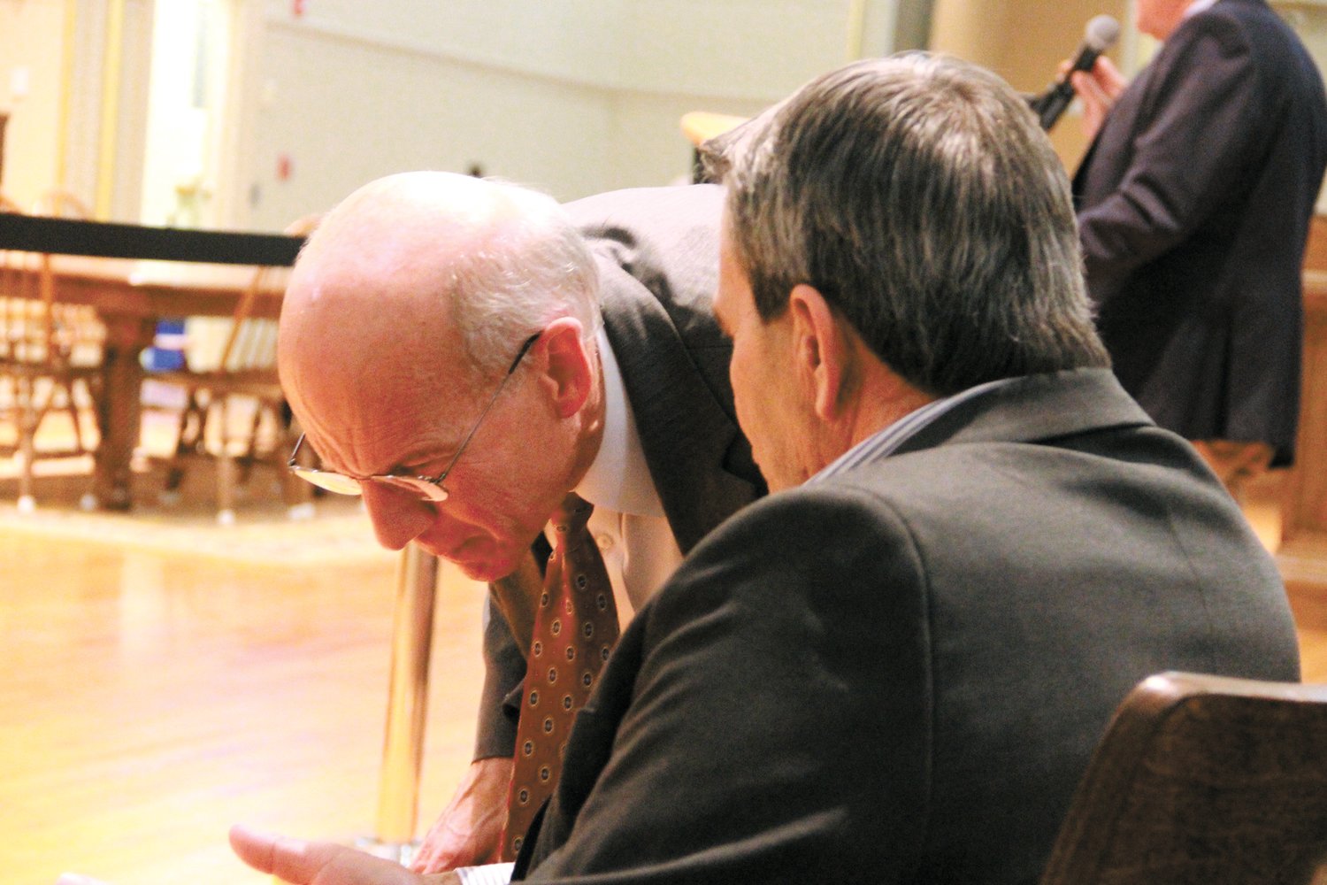 THE FINE POINTS: City Solicitor Michael Ursillo and Mayor Frank Picozzi confer during the hearing. (Warwick Beacon photos)