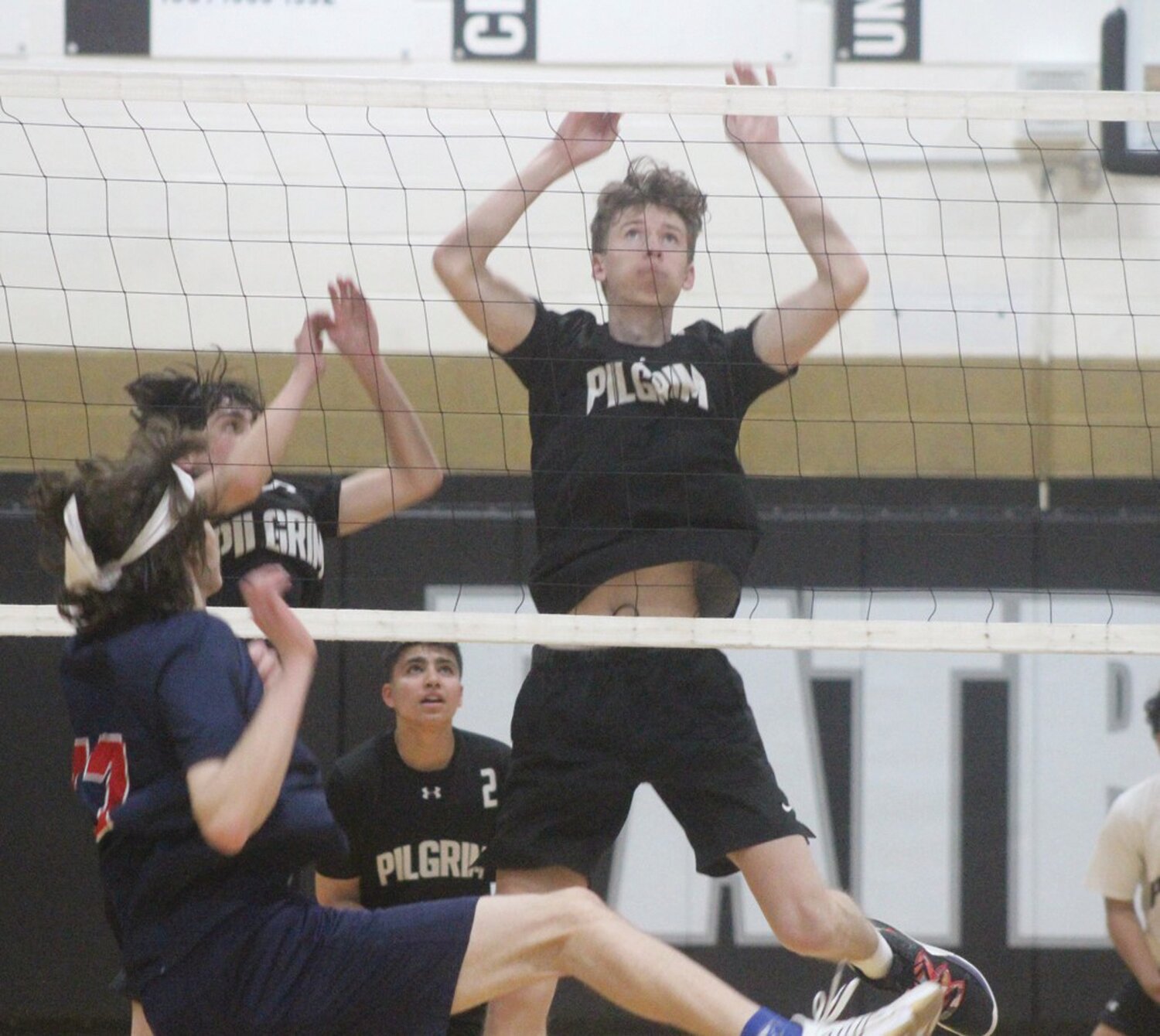 AT THE NET: Pilgrim’s Declan Faherty makes a play.