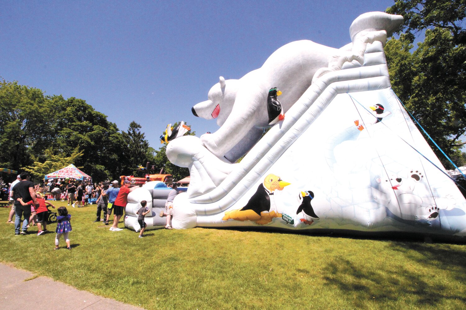THEY COULD BEARLY RESIST: Children , for that matter no one, could miss the polar bear slide that dominated Pawtuxet Village Park during the arts and crafts festival