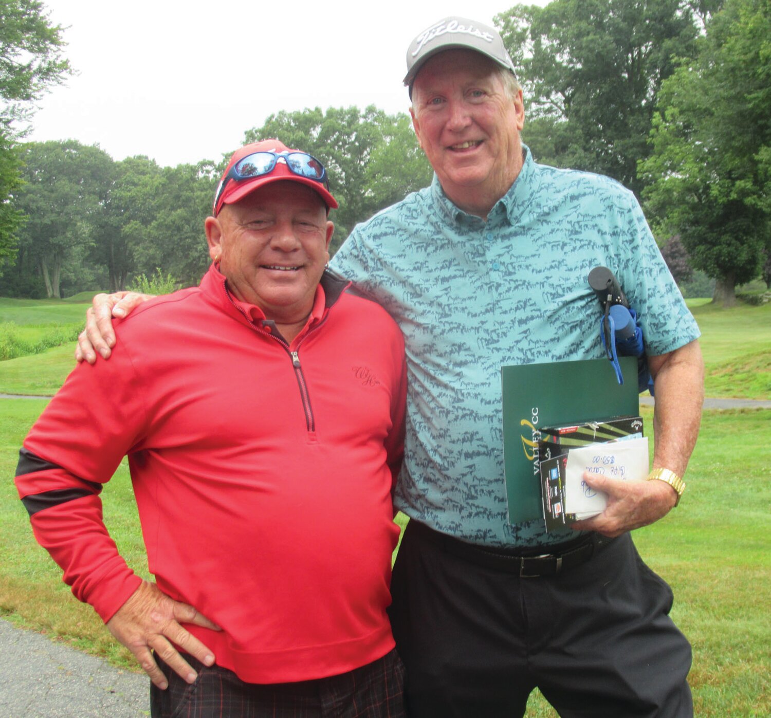 FAMILY FRIEND: John Graham (left), who has been a long-time friend of the Hopkins family, served as the official greeter to Cranston Mayor Ken Hopkins at last week’s highly successful scholarship fund golf tourney. (Herald photos by Pete Fontaine)