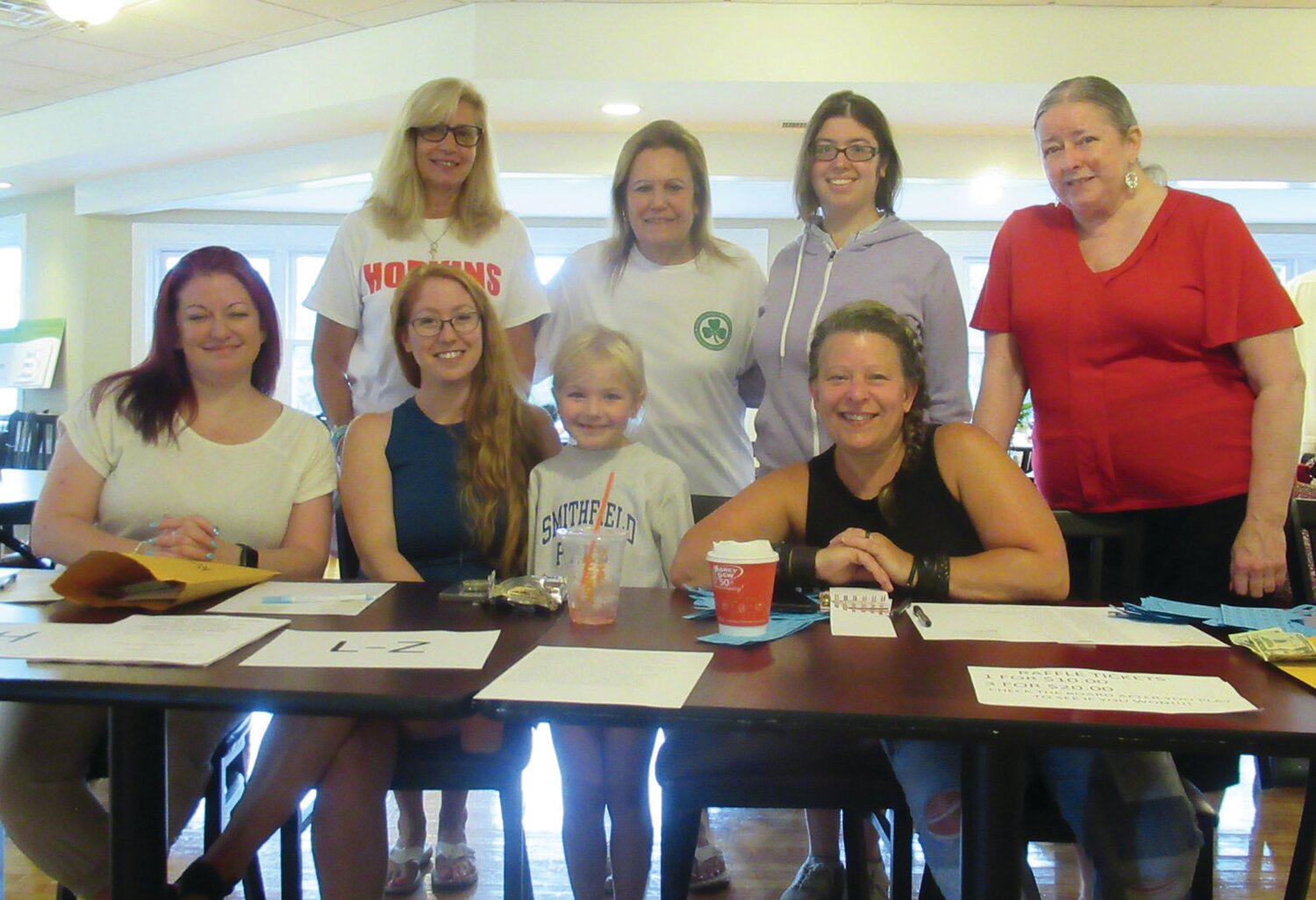 CHLOE’S CORNER: Chloe Shackelford (center), granddaughter of Cranston Mayor Ken Hopkins, joins Jen Mallowes, her mom Katie Shackelford, Laurie Chapman, Sue Beaulieu, Louis Hopkins, Brianna Puglia and Nora Warburton at the registration table prior to last week’s scholarship fund golf tourney.