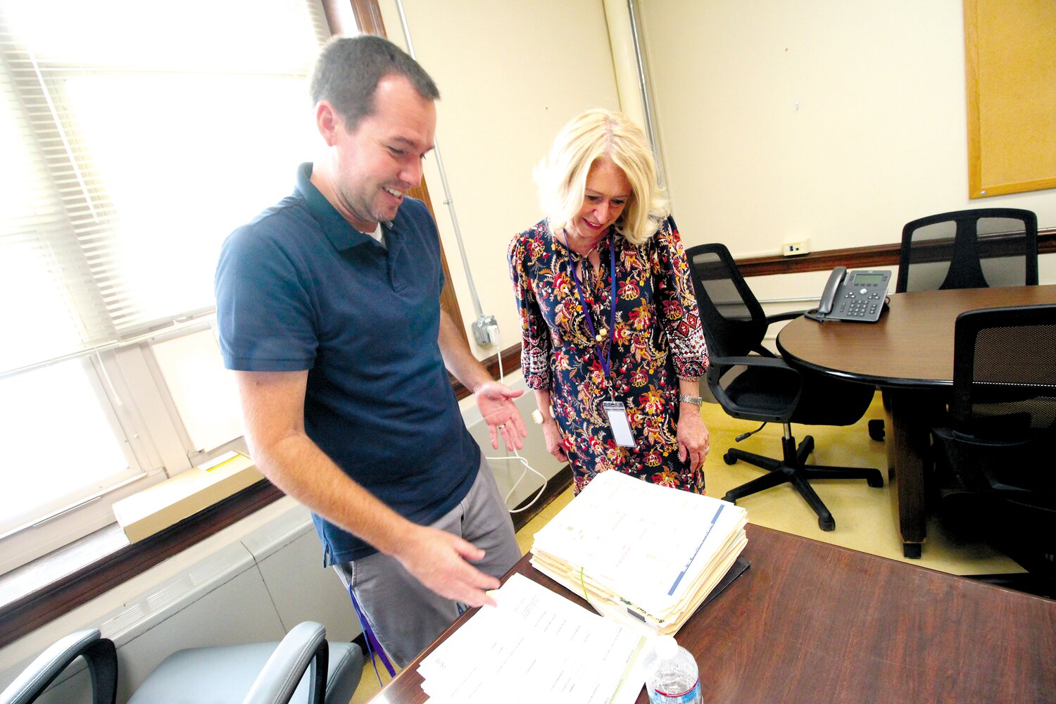 NEW TO THE JOB, NEW TO THE SCHOOL:  Newly named Oakland Beach Principal Matthew Yates goes over classroom material with Superintendent Lynn Dambruch.