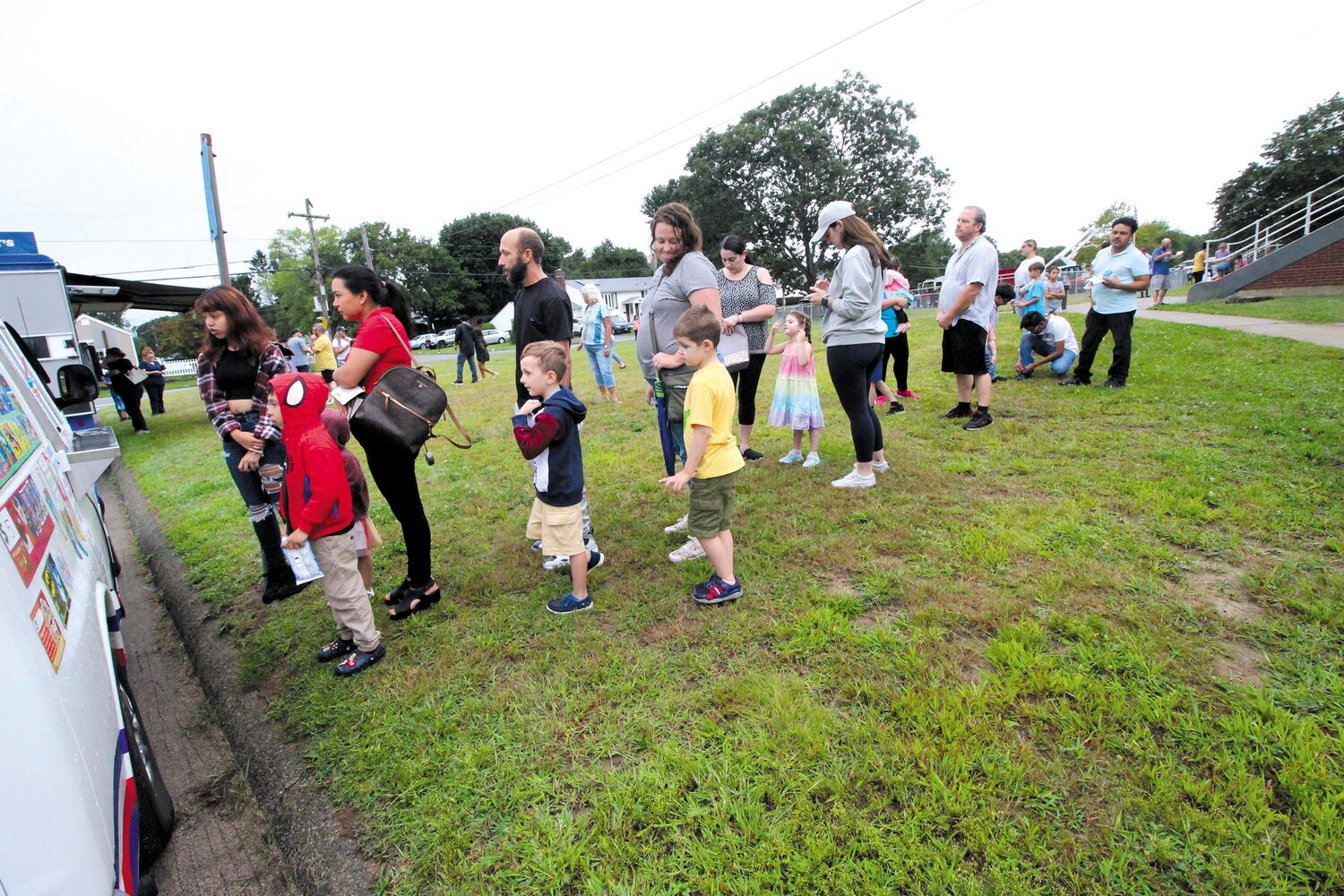 Parents and students line up for a sweet start to the school year at Kay’s Ice Cream truck during the Oakland Beach School open house and bash held Tuesday at Gorton where classes will be held this year. (Warwick Beacon photos)